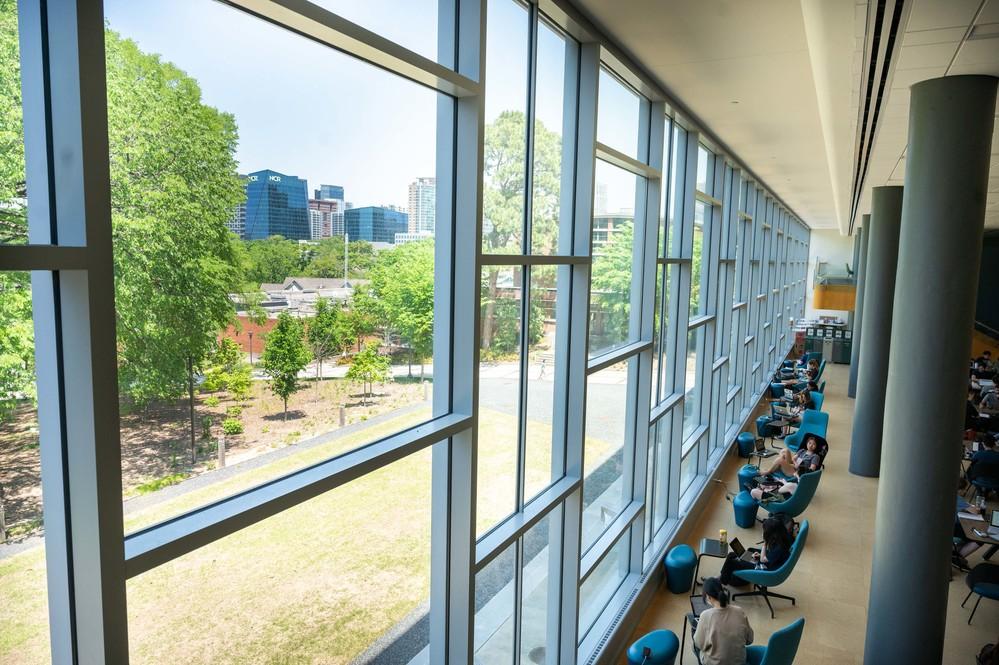 Students studying by a window.